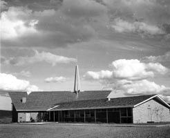 A black and white photo of the completed building - circa 1963