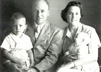 A black and white photo of Rev. Edward Arensen and his wife Esther and one of their children.