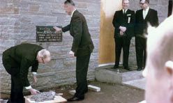 A group of people laying the cornerstone