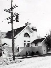 A black and white photo of the original building after one of many upgrades and remodels